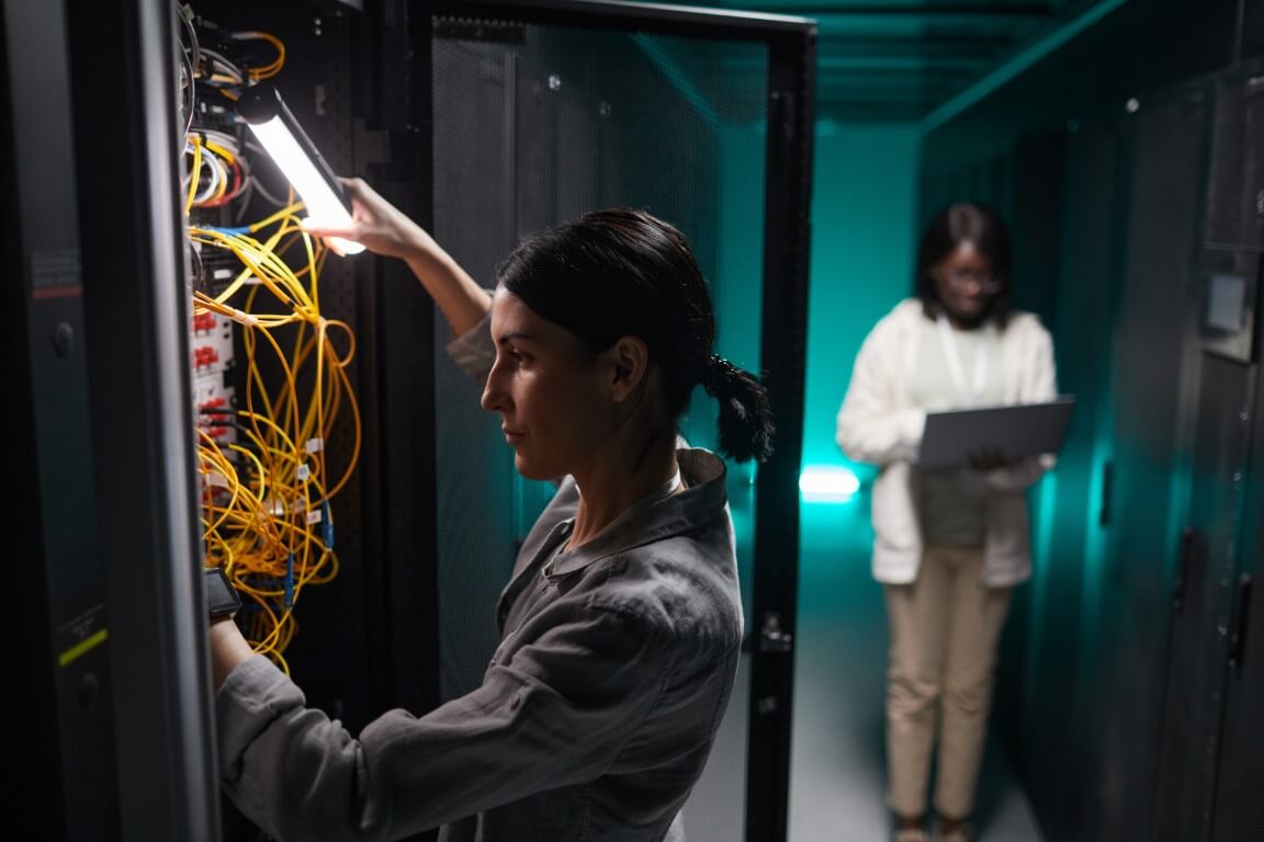 woman inspecting network cables